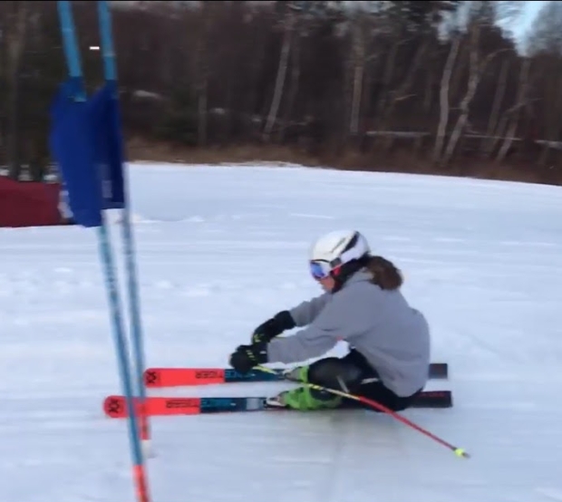 Photograph of a teen girl ski racing GS.
"I was a coordinated athlete...Who was this person that had taken over my body?"